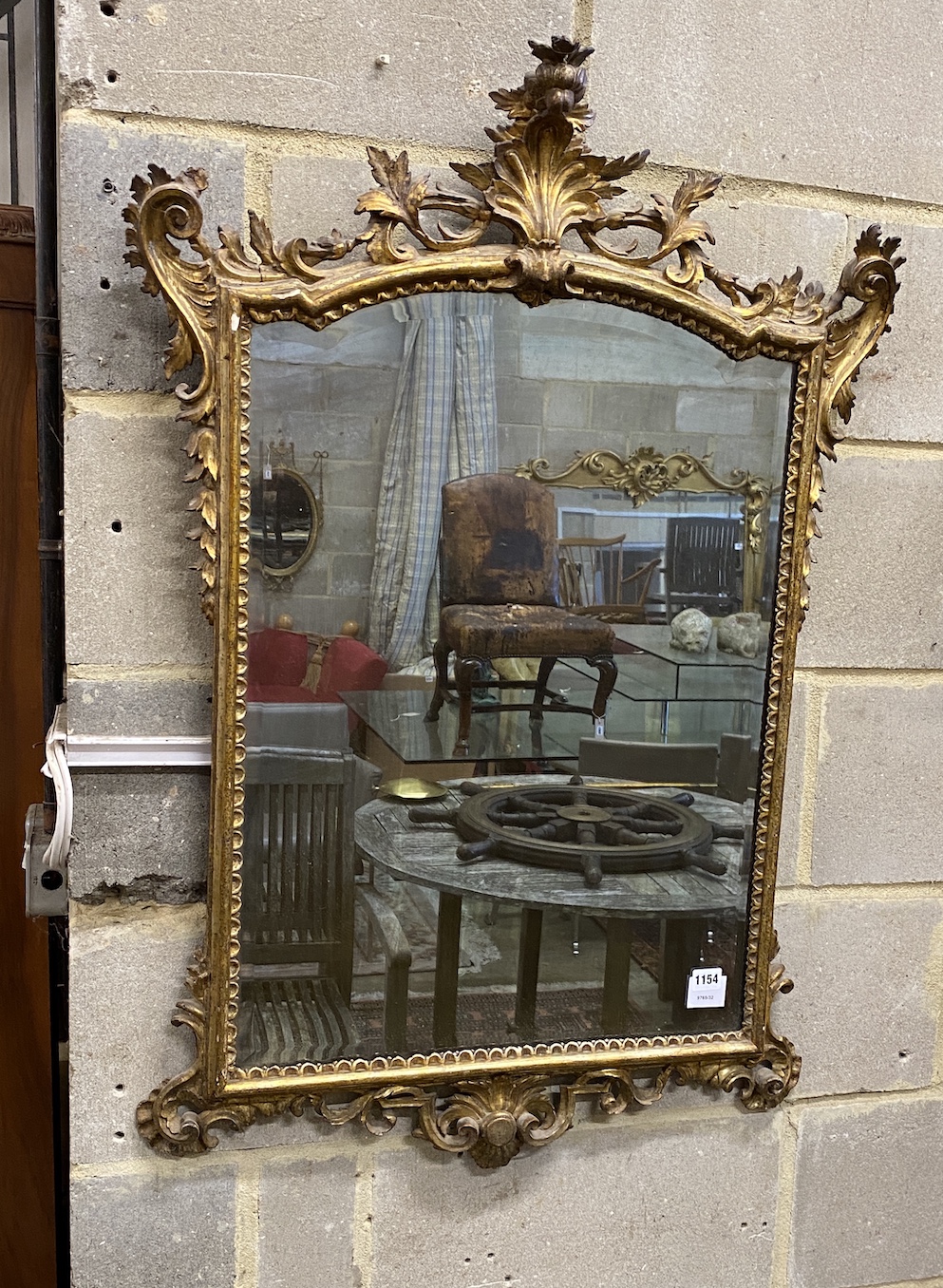 An 18th century style rectangular giltwood and composition wall mirror, width 68cm, height 104cm